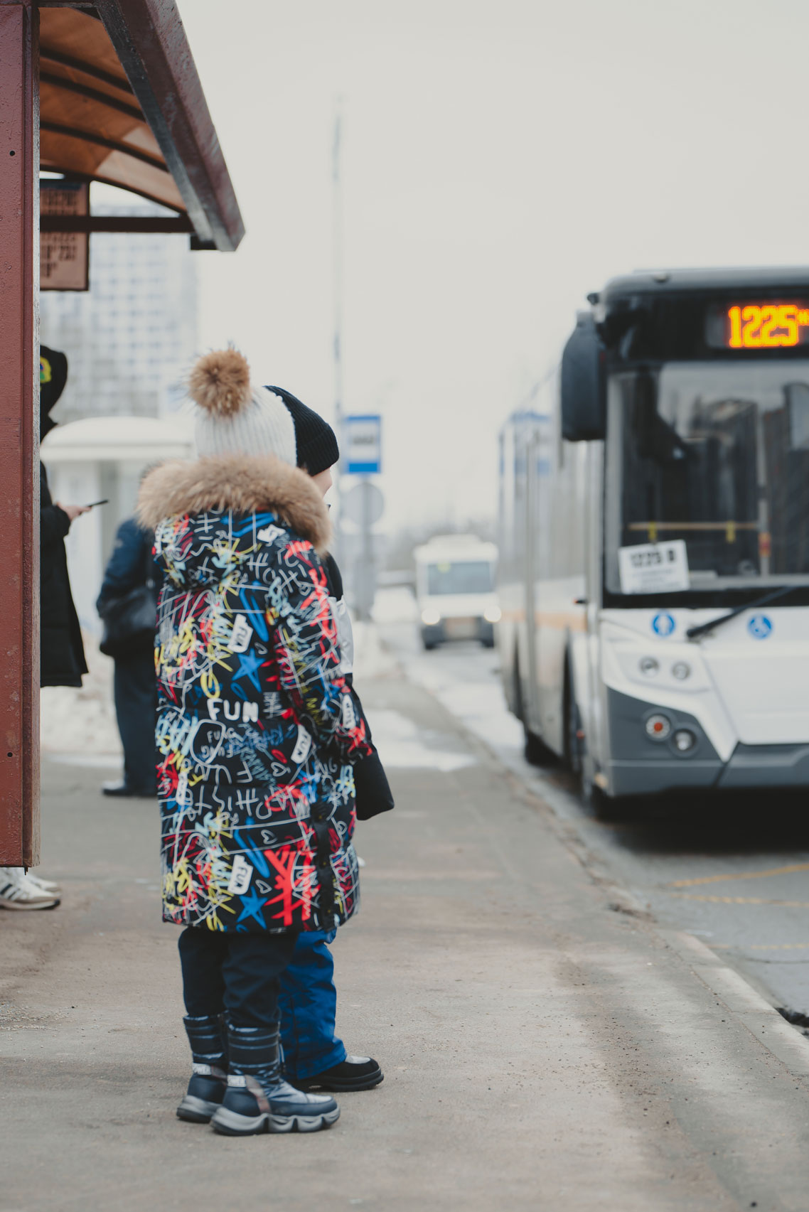 standing-at-the-bus-stop-in-winter-a-2022-02-26-18-49-59-utc